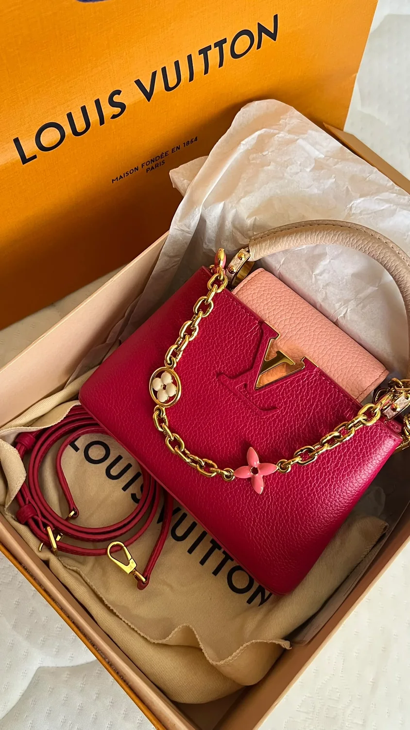 Pink and red designer handbag in its presentation box
