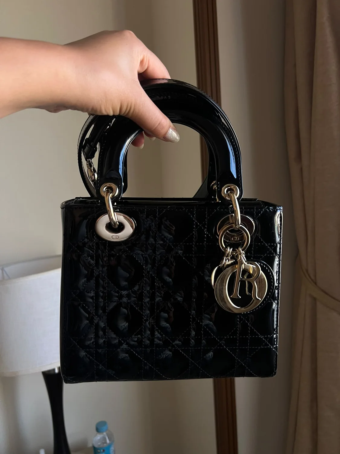 Black patent designer handbag